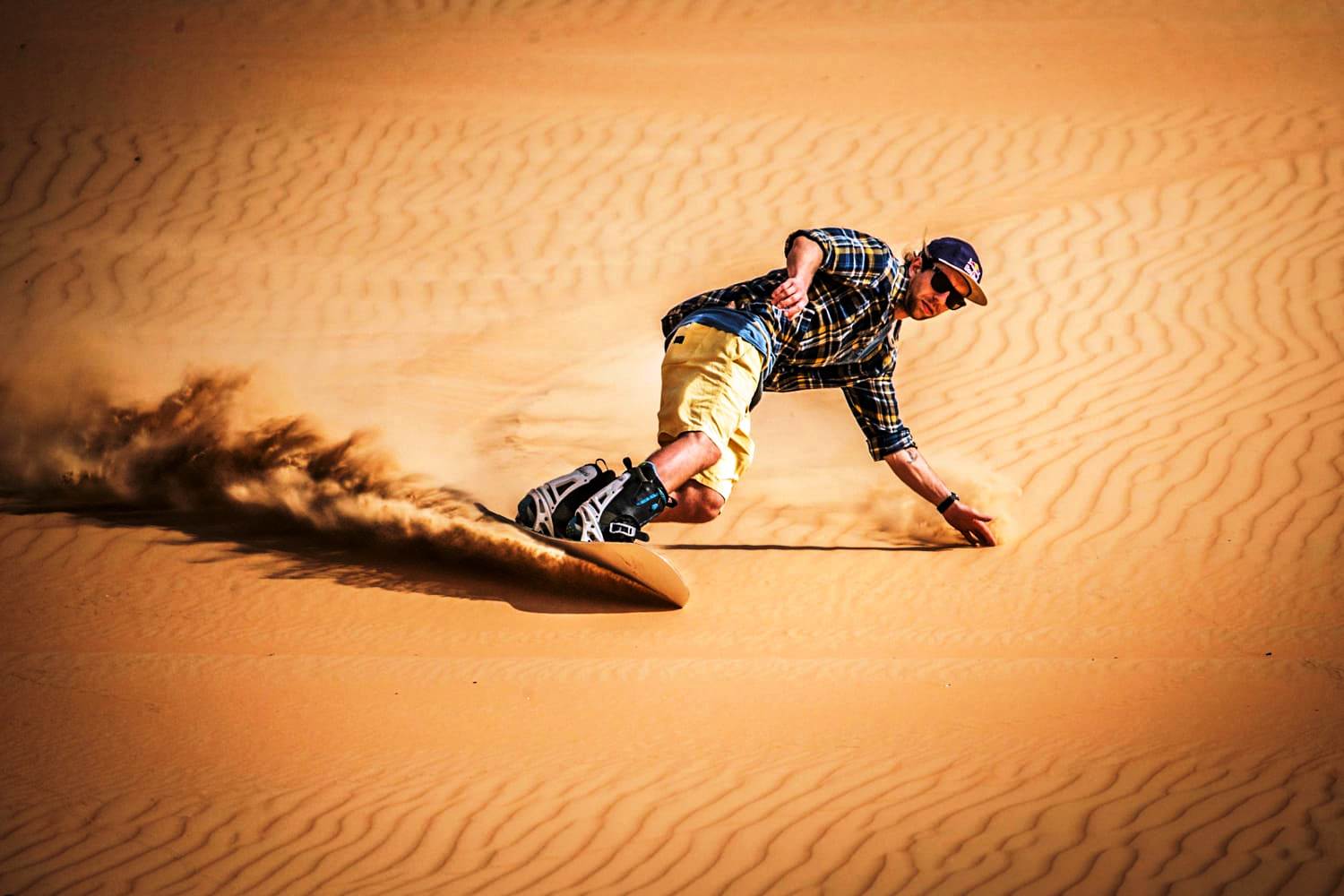 Morocco sand boarding tours in Erg Chigaga Sahara desert 
